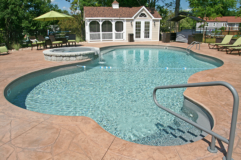 Swimming pool and stamped concrete project example 75